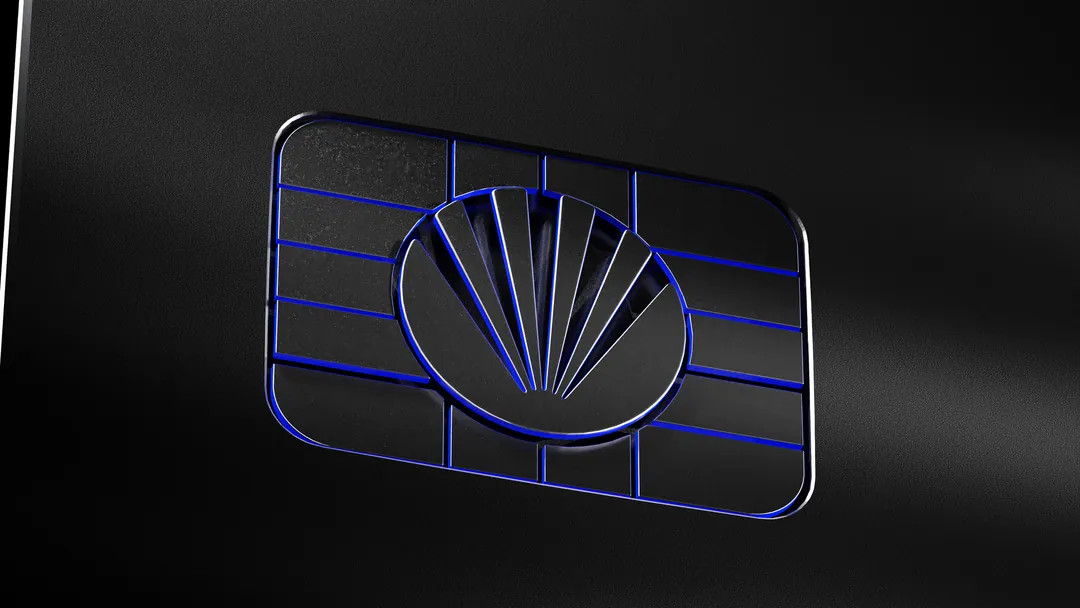 Atlas Pay chip in black metal, lit with blue light in the channels