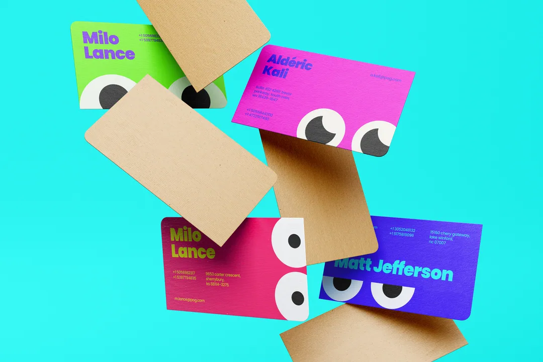POG business cards in pink, yellow, green and violet, falling over turquoise